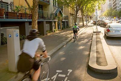 Cyclists using the physically separated bike lane on La Trobe Street