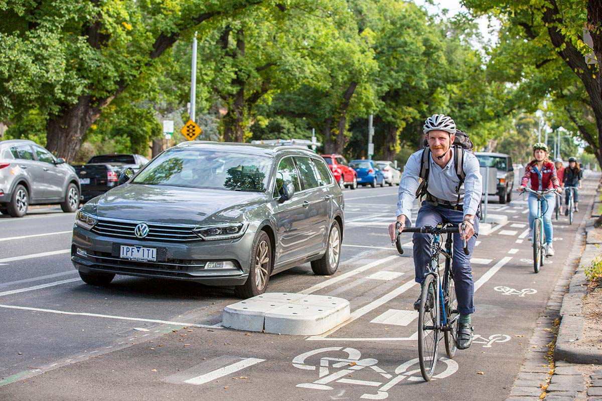 Cyclists using the kerbside lane on Swanston Street.