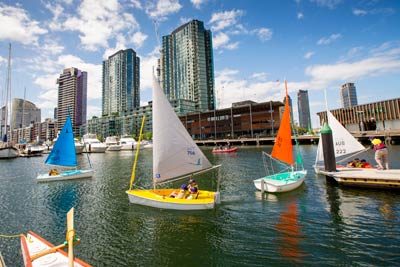 Small sailboats on the water at Docklands