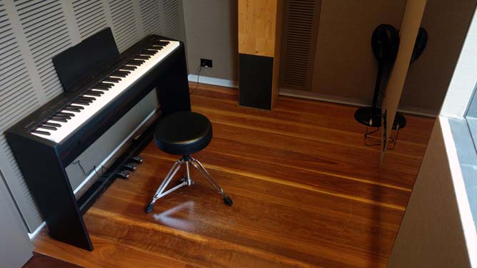 Digital piano and stool inside the practice room