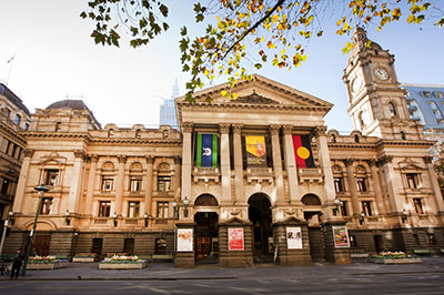 Exterior of Melbourne Town Hall with aboriginal and Torres Strait flags